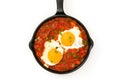 Mexican breakfast: Huevos rancheros in iron frying pan isolated Royalty Free Stock Photo