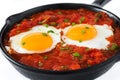 Mexican breakfast: Huevos rancheros in iron frying pan Royalty Free Stock Photo