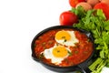 Mexican breakfast: Huevos rancheros in iron frying pan Royalty Free Stock Photo