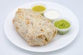 Mexican Burrito with Three Different Sauces on a White Plate Royalty Free Stock Photo