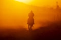 A Mexican Charro Cowboy Rounds Up A Herd of Horses Running Through The Field On A Mexican Ranch At Sunrise