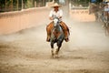 Mexican charros horseman galloping in ring, TX, US