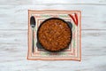 Mexican chili. Chili con carne in frying pan on white wooden background. Royalty Free Stock Photo