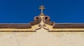 Mexican colonial cross on cornice Royalty Free Stock Photo