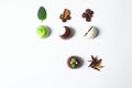 Mexican Colorful chocolate candy bonbons with mint leaves, cinnamon and coffee beans on white background