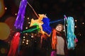 Mexican Colorful PiÃÂ±ata, Woman Holding a colorful PiÃÂ±ata celebrating Christmas in a traditional Posada in Mexico City