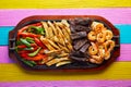 Mexican combo beef chicken fajitas shrimp Royalty Free Stock Photo