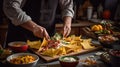 Mexican Cook preparing Chesse Nachos in a kitchen Royalty Free Stock Photo