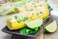 Mexican corn with butter, mayonnaise, parmesan, chili, cilantro, lime Royalty Free Stock Photo