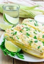 Mexican corn with butter, mayonnaise, parmesan, chili, cilantro, lime Royalty Free Stock Photo