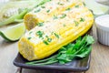 Mexican corn with butter, mayonnaise, parmesan, chili, cilantro, lime Royalty Free Stock Photo