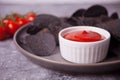 Mexican corn chips nachos with salsa dip. Black chips nachos for brutal men. Top view Royalty Free Stock Photo