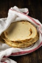 Mexican corn tortillas on dark wooden table