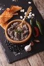 Mexican cuisine: Frijoles refritos with ingredients close-up. vertical Royalty Free Stock Photo