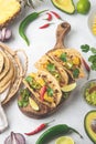 Mexican cuisine - mexican tacos al pastor, pork meat, corn tortillas, chili pepper, pineapple, avocado, cilantro, lime Royalty Free Stock Photo