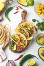 Mexican cuisine - mexican tacos al pastor, pork meat, corn tortillas, chili pepper, pineapple, avocado, cilantro, lime Royalty Free Stock Photo