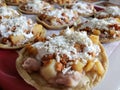 sopes of potatoes with chorizo, cream and cheese, traditional mexican food