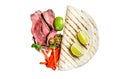 Mexican fajitas for grilled beef steak and vegetables. Isolated, white background. Royalty Free Stock Photo