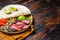 Mexican fajitas for grilled beef steak and vegetables. Wooden background. top view. copy space Royalty Free Stock Photo