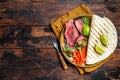 Mexican fajitas for grilled beef steak and vegetables. Wooden background. top view. copy space Royalty Free Stock Photo