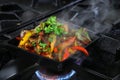 Mexican fajitas on sizzling plate