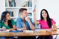 Mexican female student raising hand in classroom Royalty Free Stock Photo