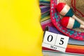 Mexican fiesta poster and Cinco de Mayo party concept theme with calendar on may 5th, red and blue maracas, sombrero and