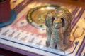 Mexican figurine, little men holding a plate of ashtray. ancient civilization.