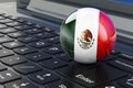 Mexican flag on laptop keyboard. Online business, education, shopping in Mexico concept. 3D rendering