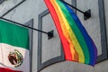 The Mexican flag and an LGBTQ Pride flag in an office building - Mexico City, Mexico Royalty Free Stock Photo