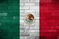 The Mexican flag painted on a brick wall. Royalty Free Stock Photo