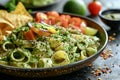 Mexican food, avocado pasta mixed with onions, tomatoes, chili and lime juice, and chips Royalty Free Stock Photo