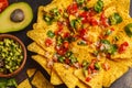 Mexican food concept. Nachos - yellow corn totopos chips with gu Royalty Free Stock Photo