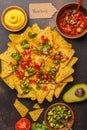 Mexican food concept. Nachos - yellow corn totopos chips with va Royalty Free Stock Photo