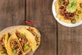 Mexican food with copy space, overhead photo of hot spicy tacos and nachos Royalty Free Stock Photo