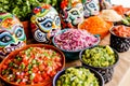 Mexican food and decorated skulls for a celebration. Royalty Free Stock Photo