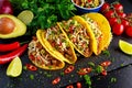 Mexican food - delicious taco shells with ground beef and home made salsa Royalty Free Stock Photo