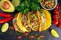 Mexican food - delicious taco shells with ground beef and home made salsa Royalty Free Stock Photo