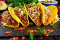 Mexican food - delicious taco shells with ground beef and home made salsa Royalty Free Stock Photo