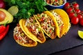 Mexican food - delicious taco shells with ground beef and home made salsa Royalty Free Stock Photo