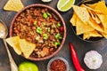Mexican food dish chili con carne. The concept of Mexican cuisine. Top view, old, rusty background.