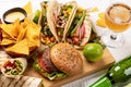 Mexican food featuring tacos, burritos, nachos, burgers