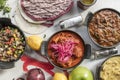 Mexican food recipe set with cochinita pibil stew, beef alamabre, lots of fruits, sauces and wheat tortillas Royalty Free Stock Photo