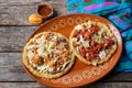 Mexican food: sopes of Chorizo and beef picadillo with cheese and beans Royalty Free Stock Photo