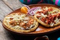 Mexican food: sopes of Chorizo and beef picadillo with cheese and beans Royalty Free Stock Photo