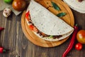 Mexican food - vegetarian quesadilla on wooden board. Royalty Free Stock Photo