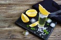 Mexican Gold Tequila in the shot glass with lemon and sea salt on dark table. Royalty Free Stock Photo