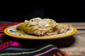 Mexican green enchiladas with chicken and cheese on wooden background Royalty Free Stock Photo