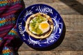 Mexican green ranchero eggs on tortilla toast