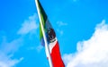 Mexican green white red flag with blue sky in Mexico Royalty Free Stock Photo